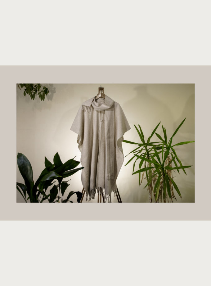 Oaxacan raw wool poncho with fringed edges, attached scarf and covered wool buttons